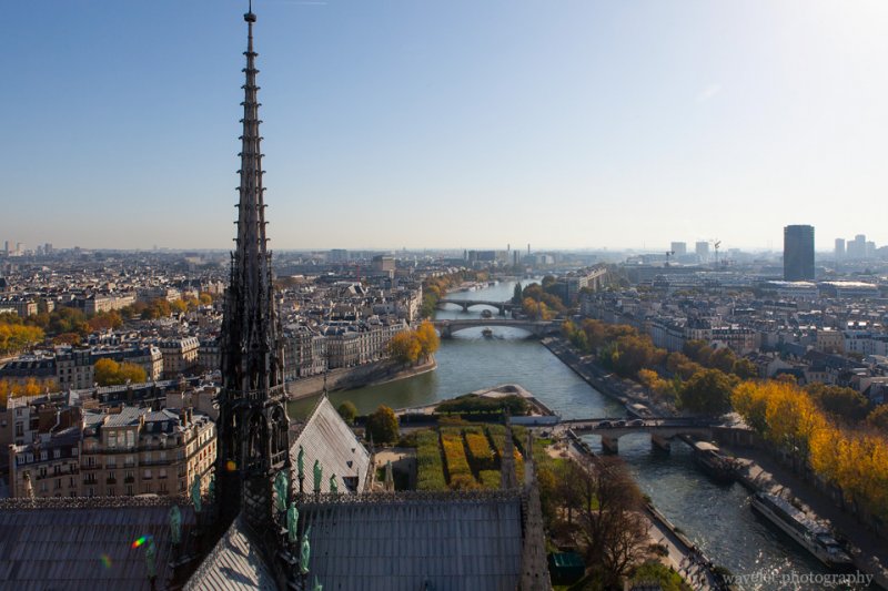 Overlook River Seine to the east with the spire of Notre-Dame de Paris in the foreground