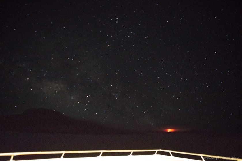 Night sky and volcano eruptino in Isabela Island, Sombrero Chino, Santiago Island