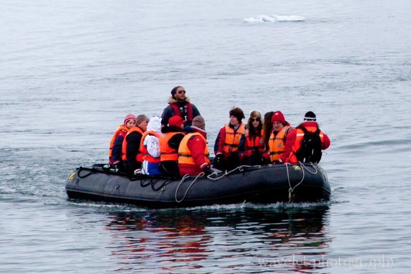 Visitors Wearing Parka and Life Vest on a Zodiac