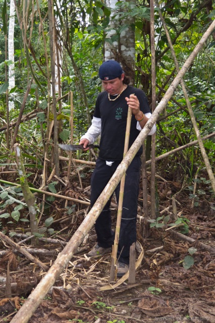 The Guide is Making a Walking Stick for Us.