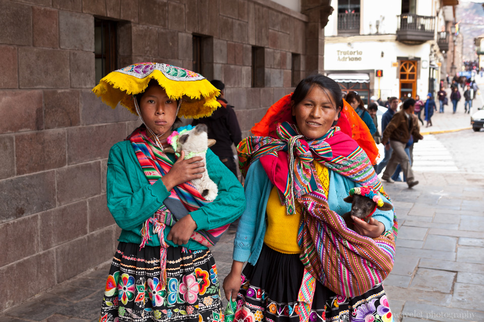 Women in traditional costumes. They ask small tips for taking pictures with them, Plaza de Armas, Cusco