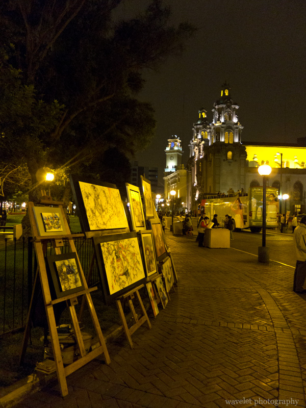 Painting stands in front of Iglesia de la Virgen Milagrosa, Parque Kennedy, Miraflores, Lima