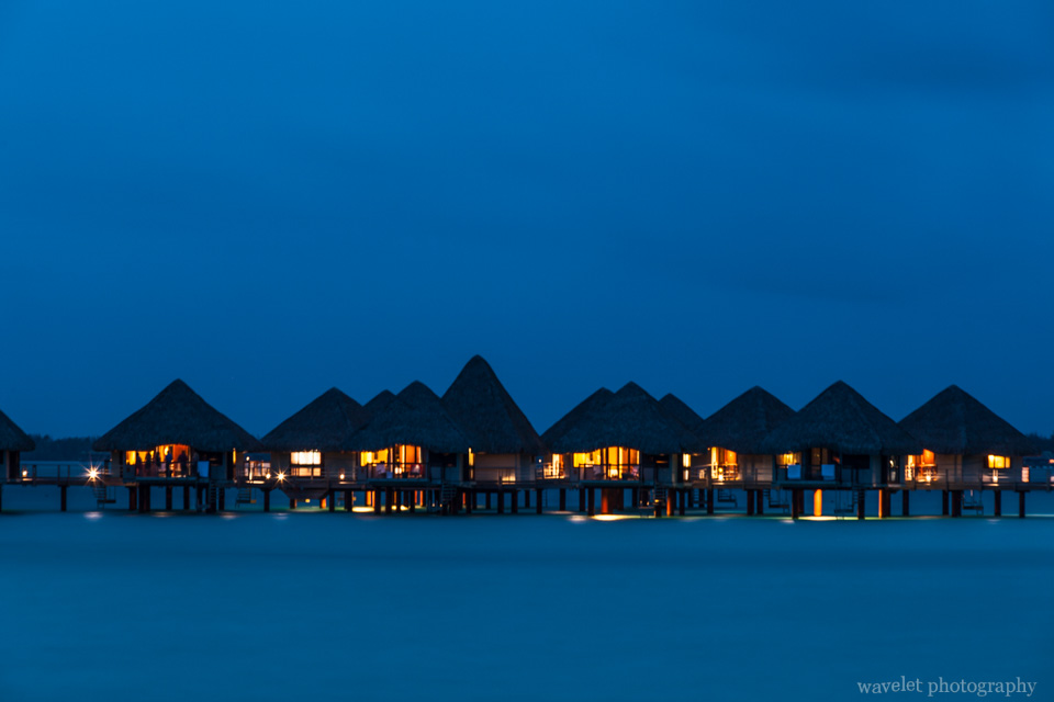 Night view of overwater bungalows of Le Méridien Bora Bora